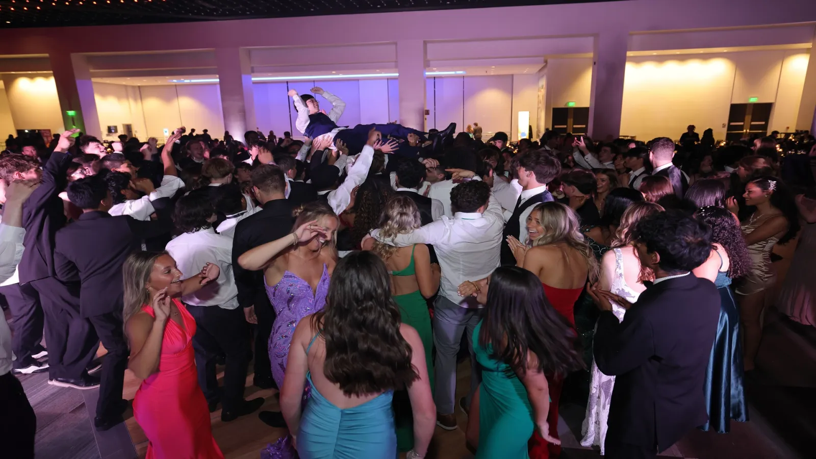 Student crowd surfing at the 2024 Shaker Senior Prom at the Albany Capital Center