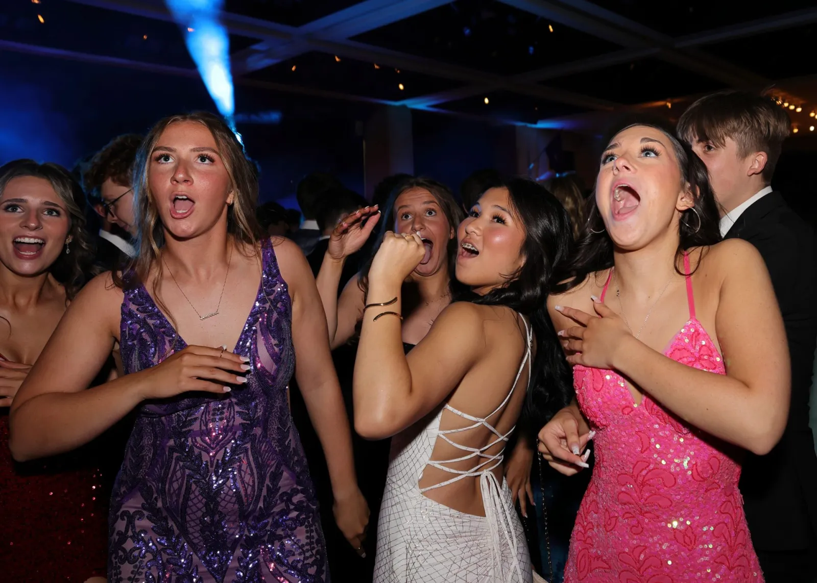 Students singing along on the dance floor at the 2024 Shaker Junior Prom