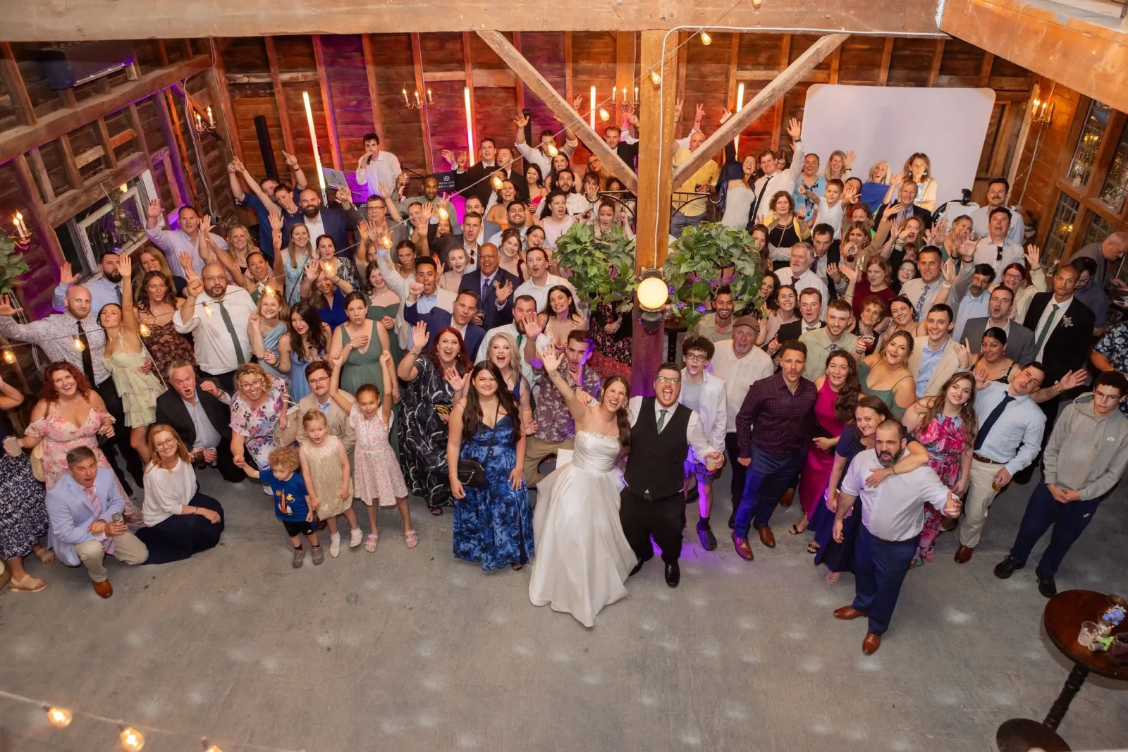 Bride and groom's first dance under string lights at an Albany, NY wedding reception