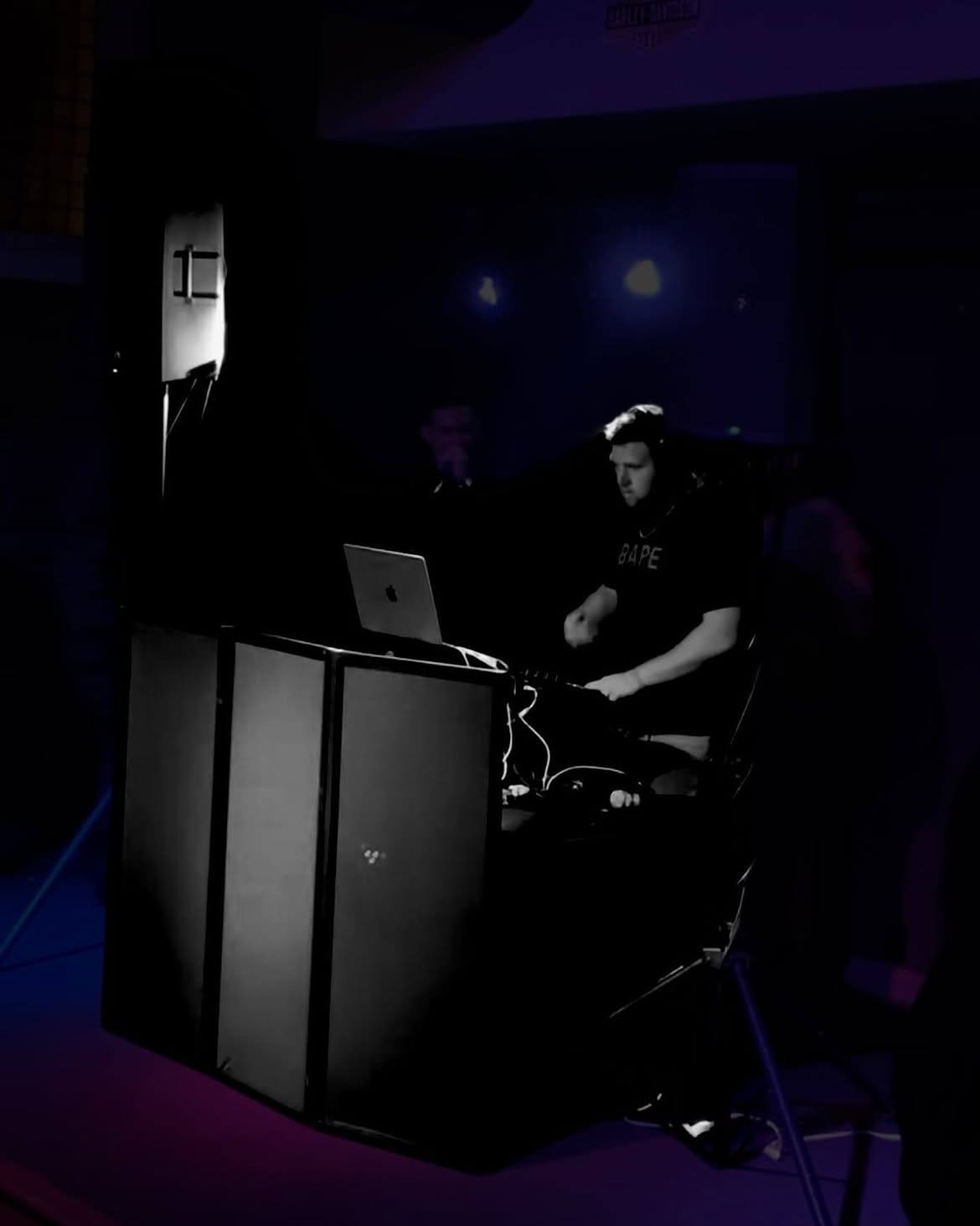 DJ Bump mixing live in the dark at a school dance